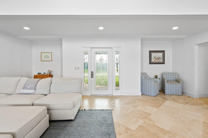 Welcome to this exceptional single-story waterfront residence in - photo 5