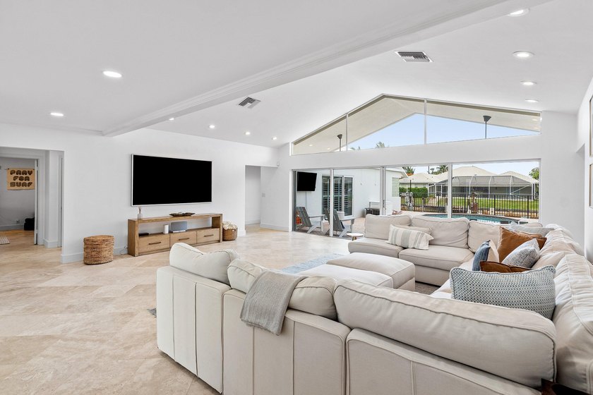 Welcome to this exceptional single-story waterfront residence in - photo 7