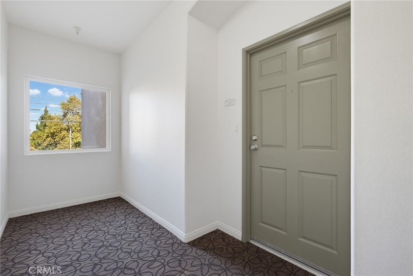 Welcome to this spacious 3-bedroom, 2.5-bath corner-unit - photo 2