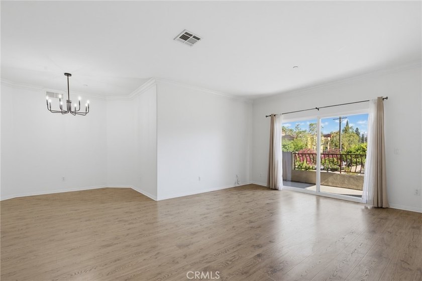 Welcome to this spacious 3-bedroom, 2.5-bath corner-unit - photo 3