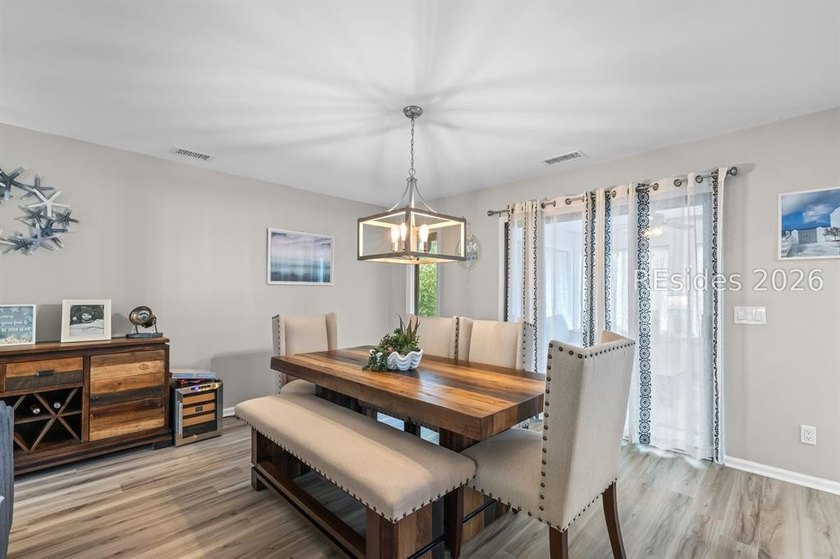 This beautifully updated residence offers laminate wood flooring - photo 11