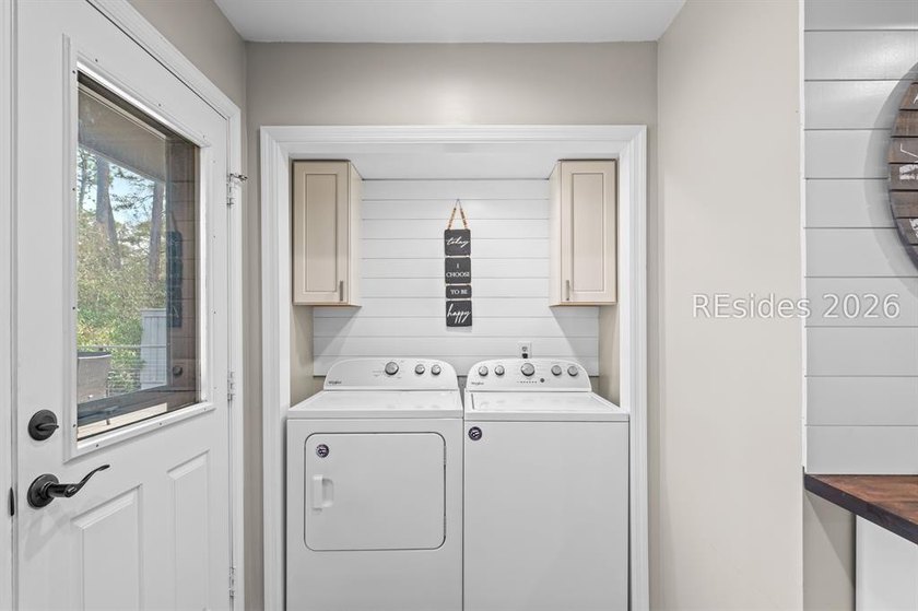 This beautifully updated residence offers laminate wood flooring - photo 20