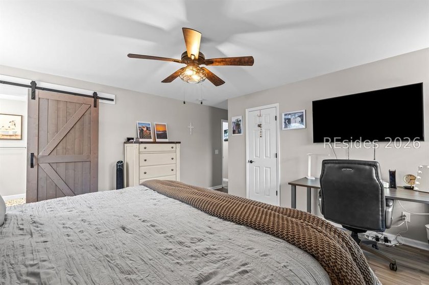 This beautifully updated residence offers laminate wood flooring - photo 23