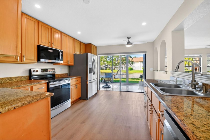 STUNNING LAKESIDE RENOVATION! 1st-floor condo offers expansive - photo 4