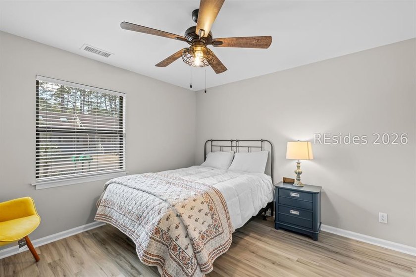 This beautifully updated residence offers laminate wood flooring - photo 27
