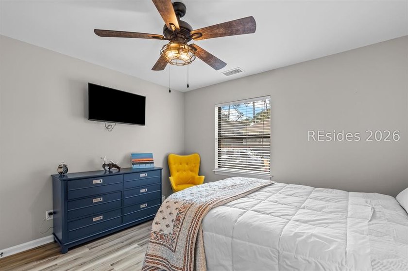 This beautifully updated residence offers laminate wood flooring - photo 29