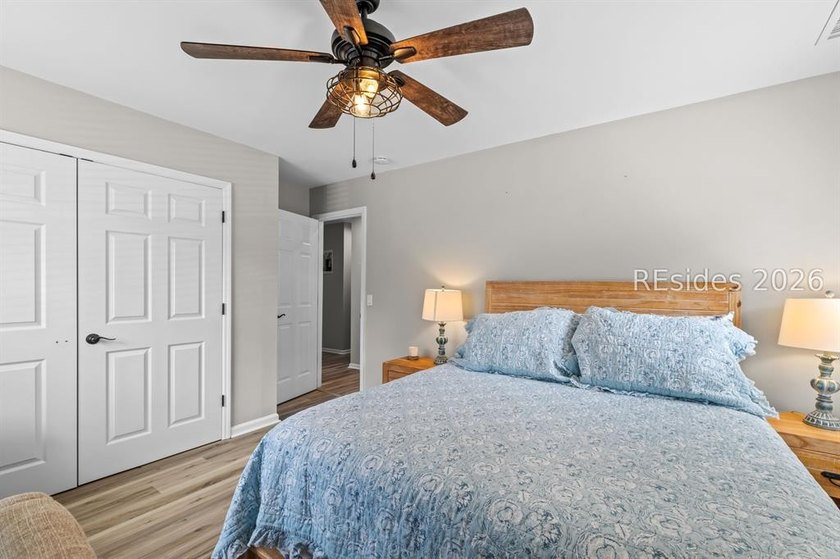 This beautifully updated residence offers laminate wood flooring - photo 31