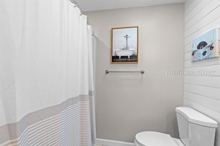 This beautifully updated residence offers laminate wood flooring - photo 33