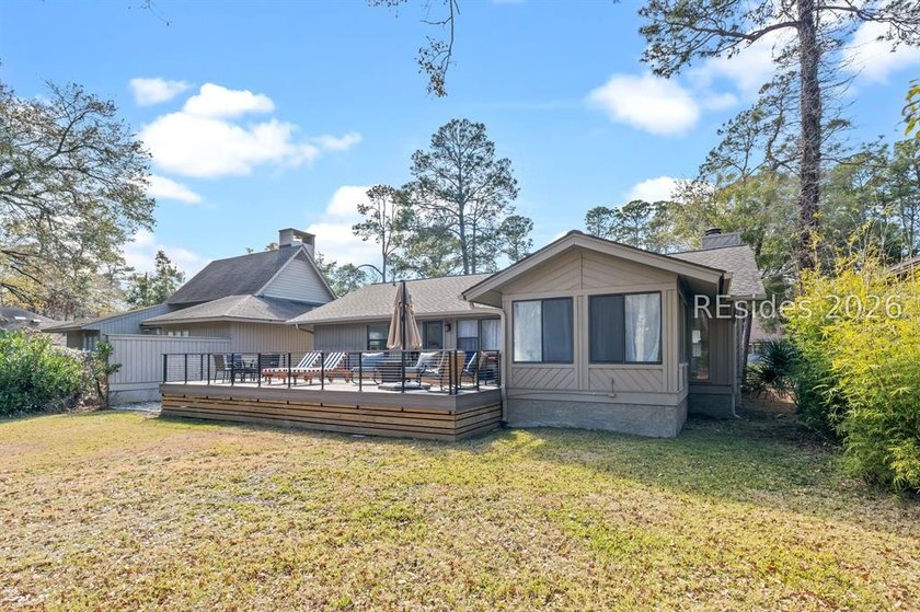 This beautifully updated residence offers laminate wood flooring - photo 34