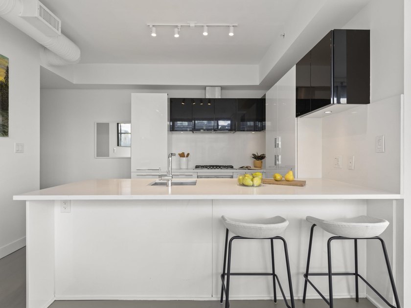 Perched on the coveted NW comer of the sub-penthouse level, this - photo 3