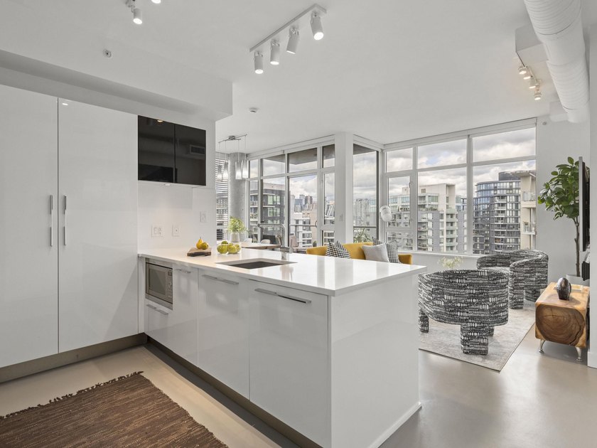 Perched on the coveted NW comer of the sub-penthouse level, this - photo 4