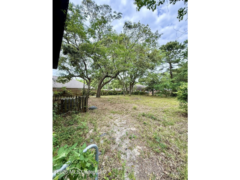 AS-IS Investment Opportunity in Ocean Springs! Unlock the - photo 2