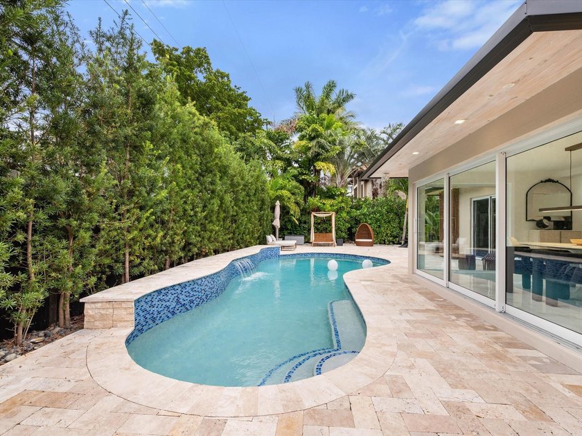 LUXURY updated 4 bedroom/3 bathroom SMART home in Coral Ridge - photo 3