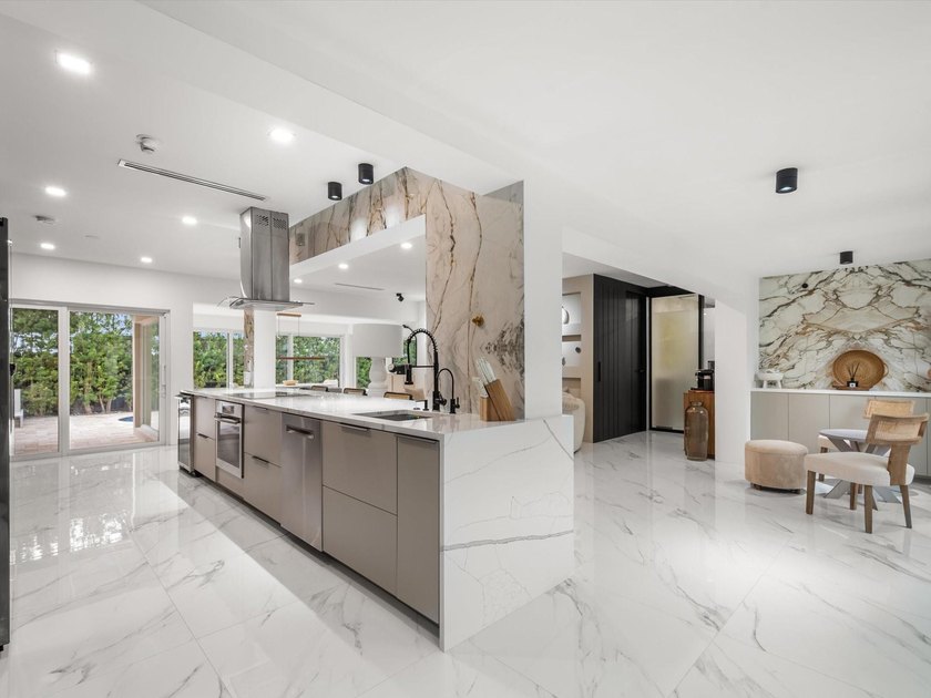 LUXURY updated 4 bedroom/3 bathroom SMART home in Coral Ridge - photo 8