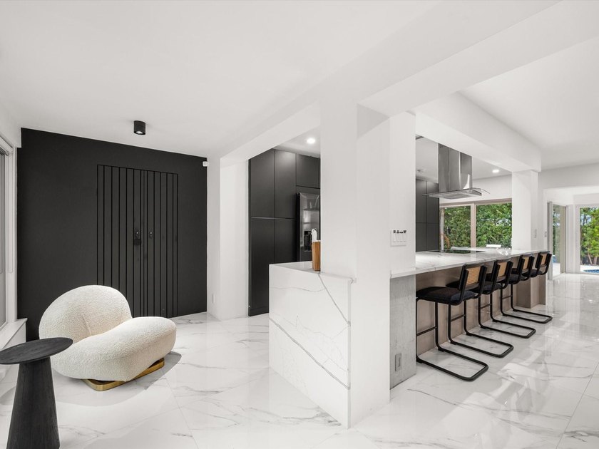 LUXURY updated 4 bedroom/3 bathroom SMART home in Coral Ridge - photo 9