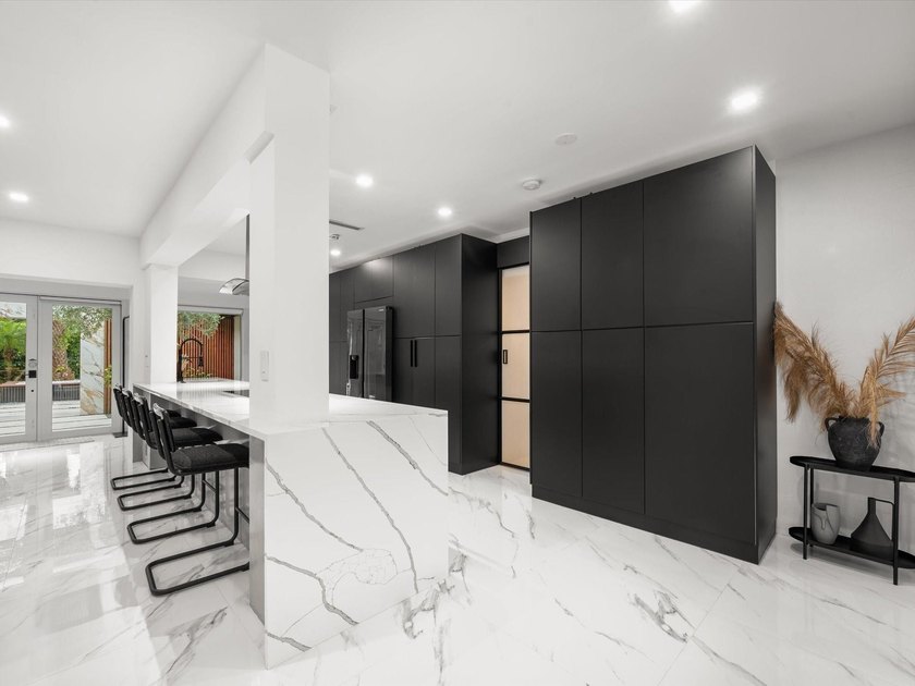 LUXURY updated 4 bedroom/3 bathroom SMART home in Coral Ridge - photo 10