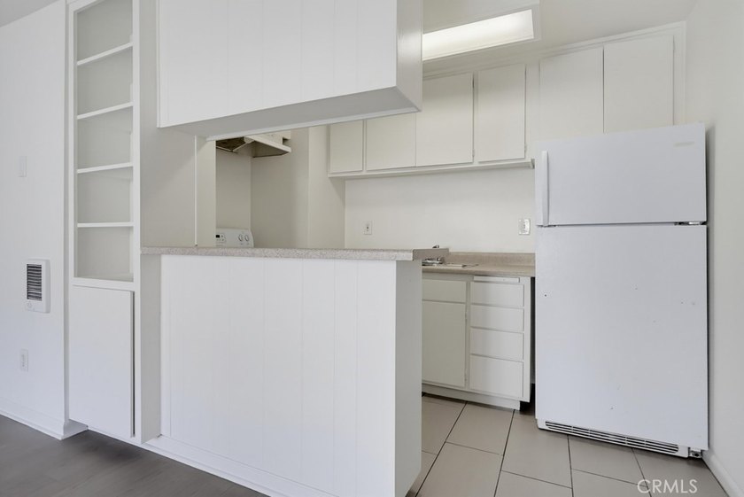 Don't miss this ground level studio condo with inside view of - photo 4