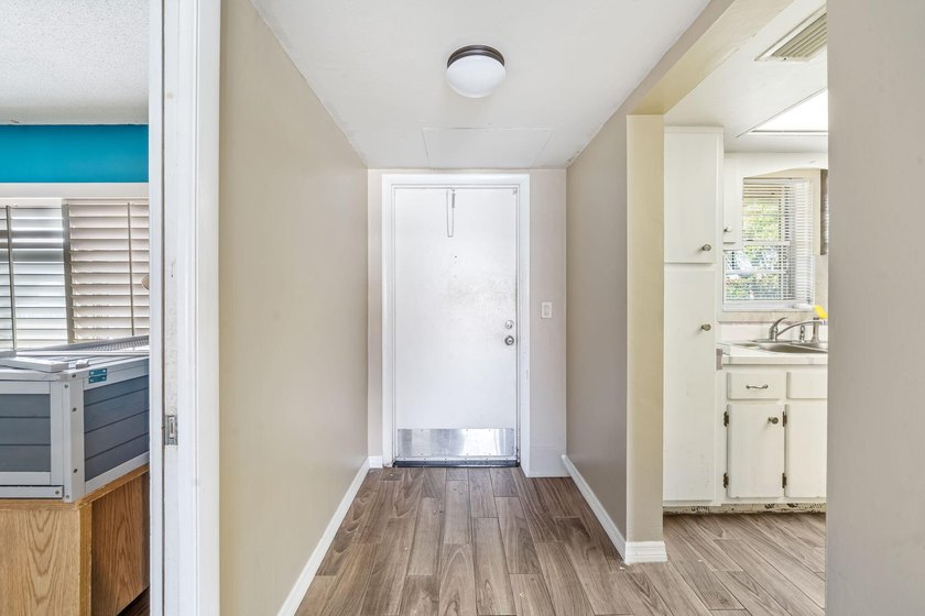 PRICED TO SELLe find your North Palm oasis. Nestled right in the - photo 3