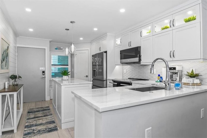 Situated in the coveted A-building, A209 offers sweeping - photo 17