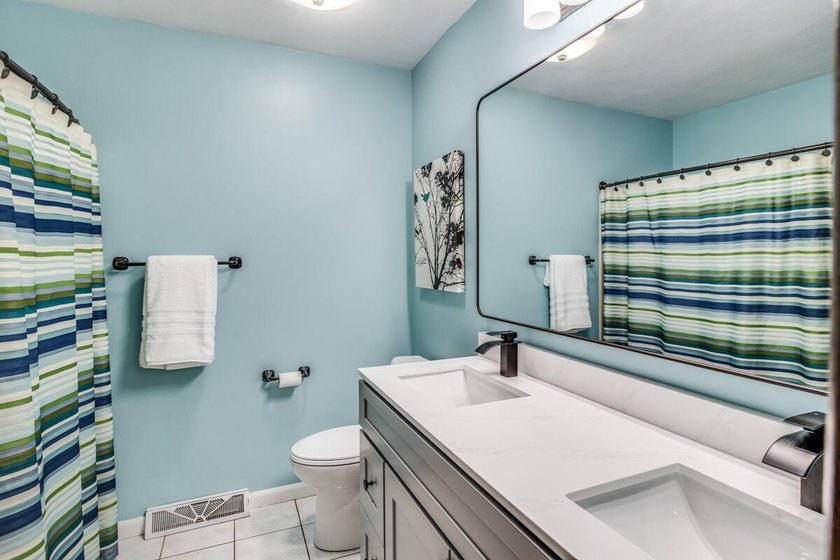 LAKE ACCESS! Spacious 4-bedroom, 2.5-bath quad-level home in - photo 19