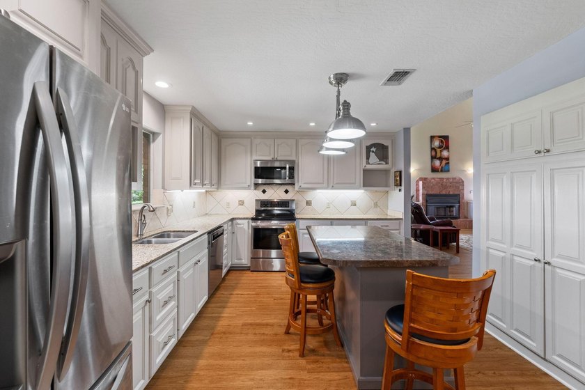 Enjoy morning coffee in your sunroom overlooking the private - photo 8