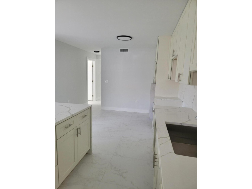 I am pleased to present this fully renovated, with new - photo 4