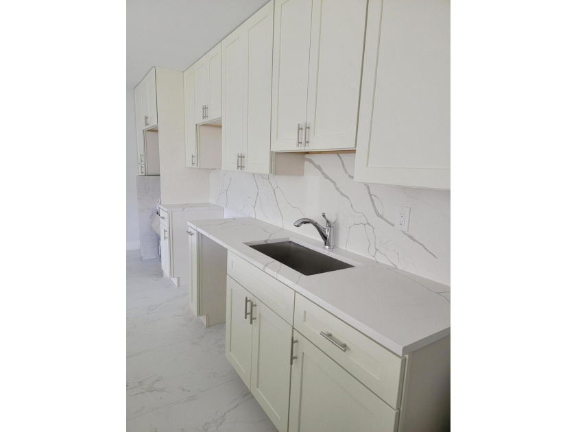 I am pleased to present this fully renovated, with new - photo 5