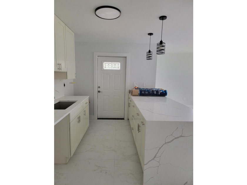 I am pleased to present this fully renovated, with new - photo 6