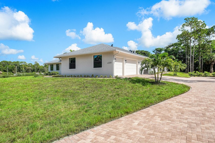 Exceptional new construction in Jupiter Farms with high-end - photo 3