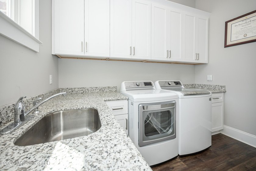 Welcome to this stunning custom-built home in the highly - photo 30