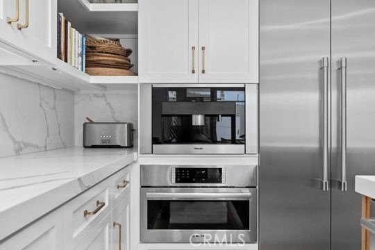 Fully reimagined coastal residence with comprehensive 2021 - photo 8