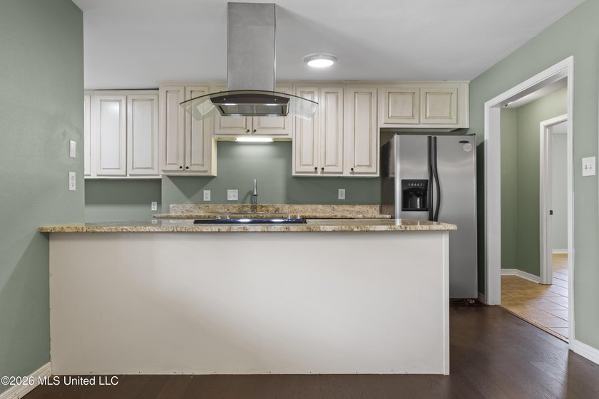 Welcome home to this beautifully updated 4-bedroom, 2-bath - photo 11