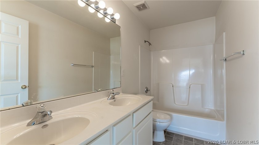 Discover this top-floor 3-bedroom, 3-bathroom condo with a - photo 11