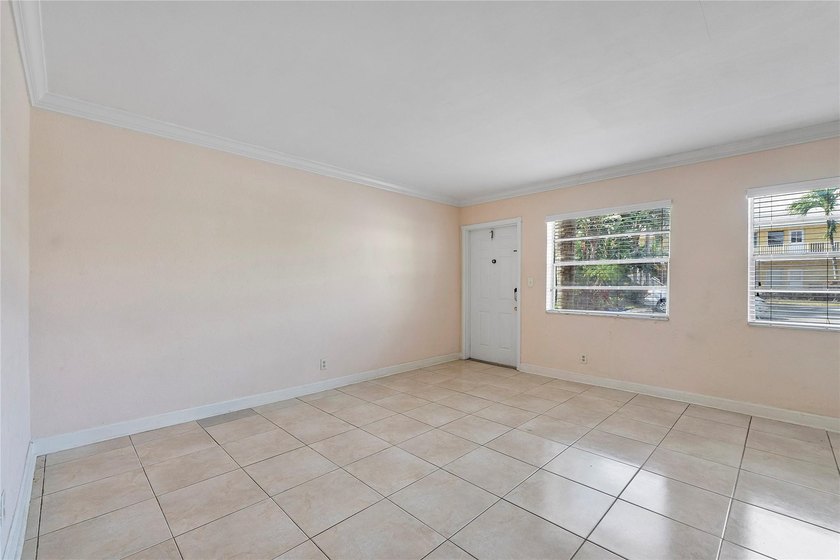 Discover a chic 2-bedroom, 1-bath corner unit condo with - photo 5