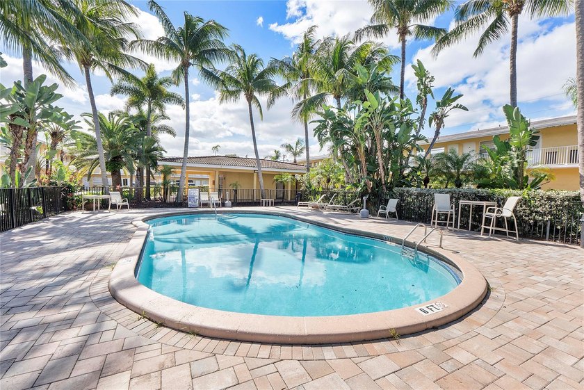 Discover a chic 2-bedroom, 1-bath corner unit condo with - photo 10