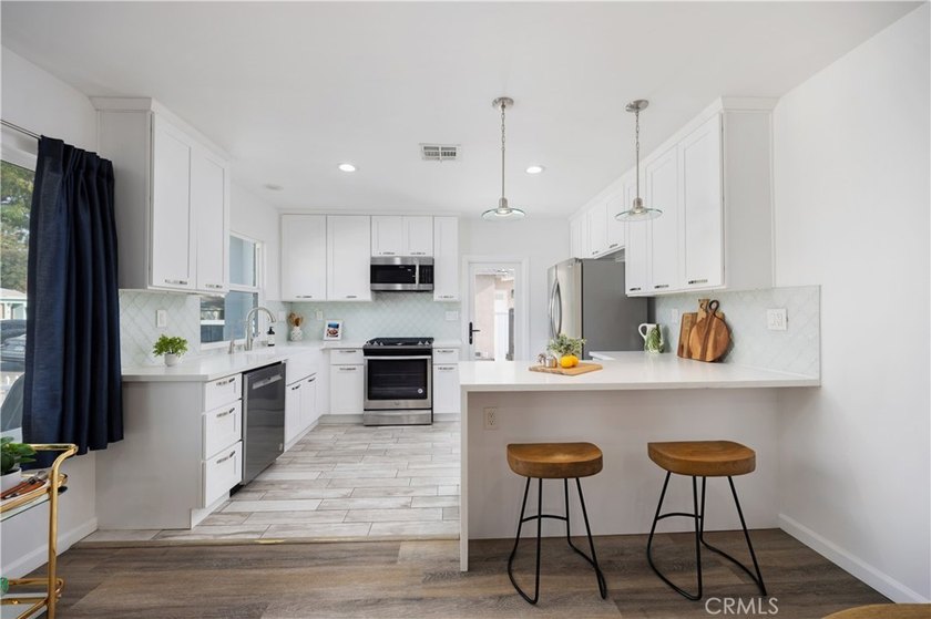Welcome home to 3833 Ocana Avenue, a fully remodeled 3-bedroom - photo 6