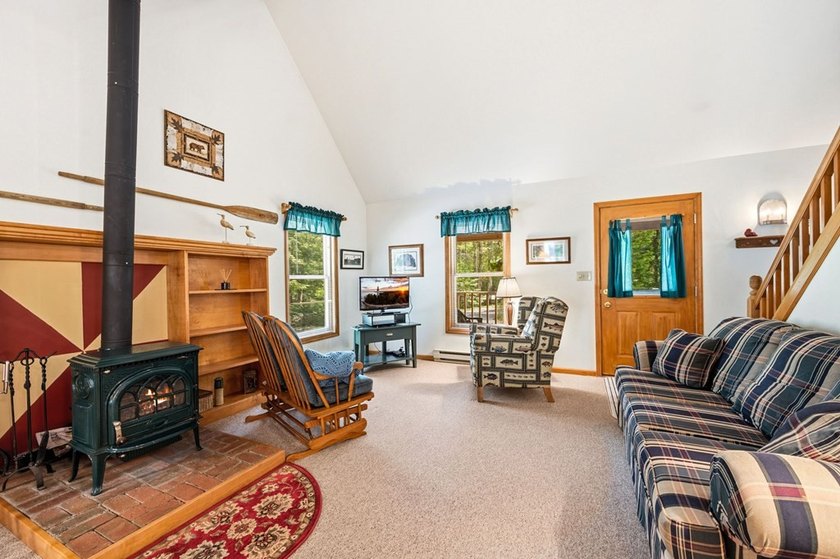 Tucked away in the woods and just a short walk from deeded water - photo 7