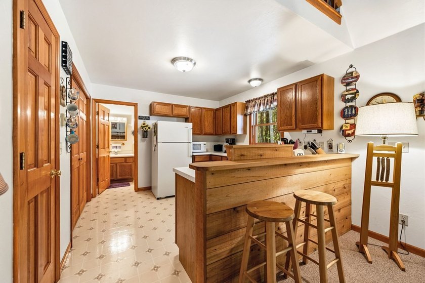 Tucked away in the woods and just a short walk from deeded water - photo 9