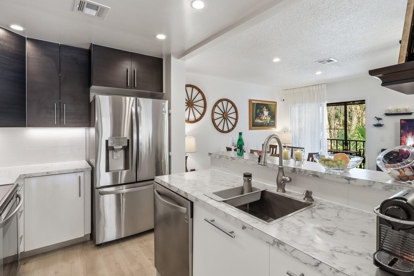 Welcome to this beautifully RENOVATED second-floor condo - photo 3