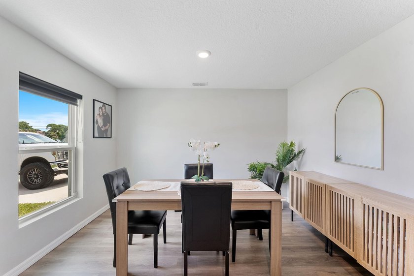 Discover this stunning 4 bedroom, 2 bathroom single family home - photo 3