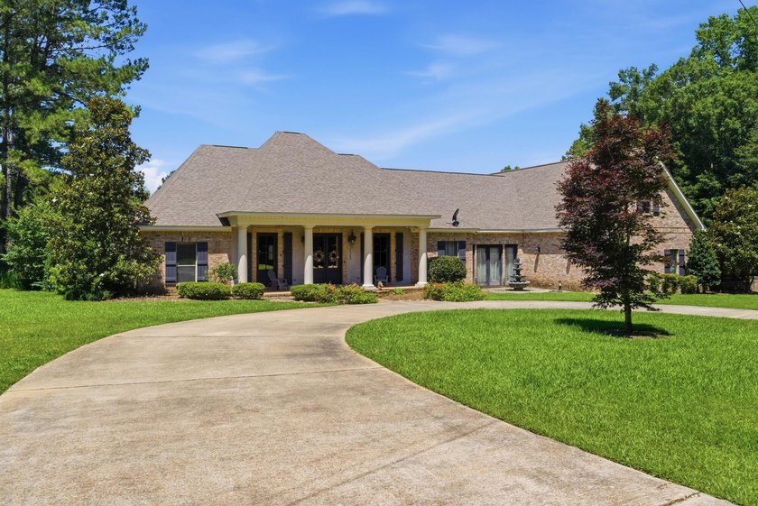 Perfectly situated on nearly 5 acres, a 5000 sq ft home plus a - photo 2