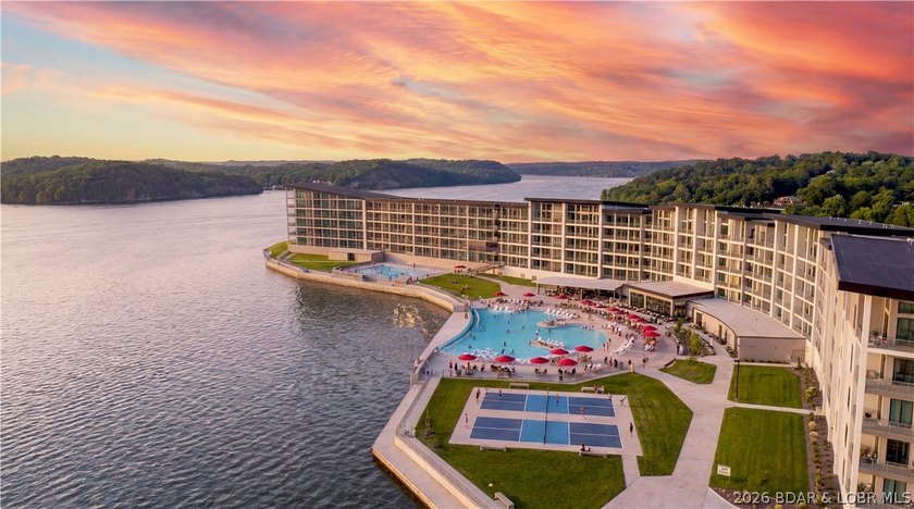 Wake up to shimmering lake views and end the day watching the - photo 24