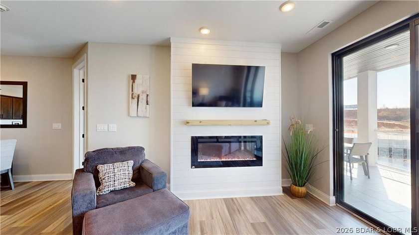 Wake up to shimmering lake views and end the day watching the - photo 25