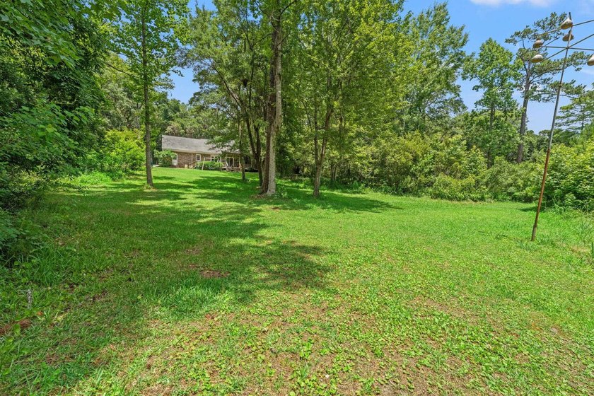 Nestled on over an acre of waterfront property in the desirable - photo 29