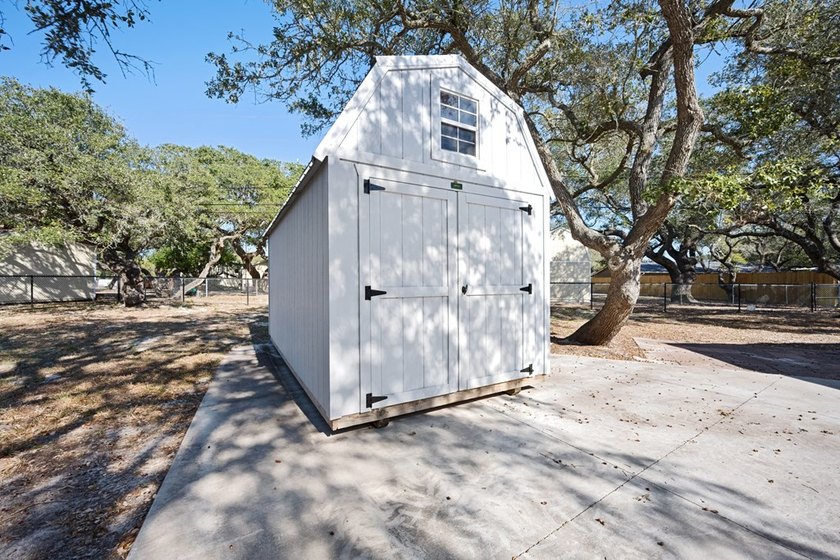 Tucked beneath the shade of towering coastal live oaks, this - photo 40
