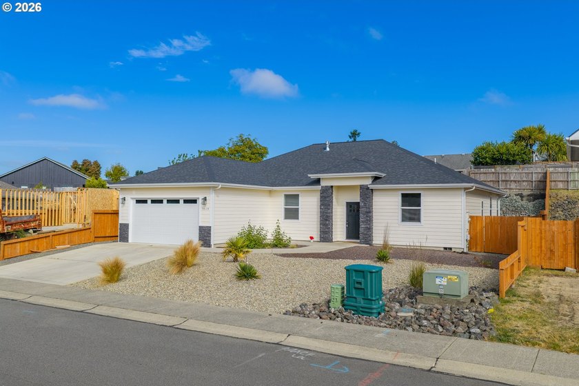 Experience modern coastal living in this custom-built 2023 home - photo 3