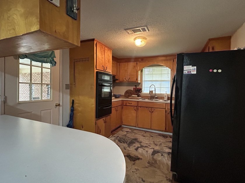Welcome to this versatile 4-bedroom, 2-bath home offering space - photo 4