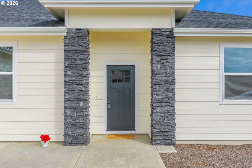 Experience modern coastal living in this custom-built 2023 home - photo 6