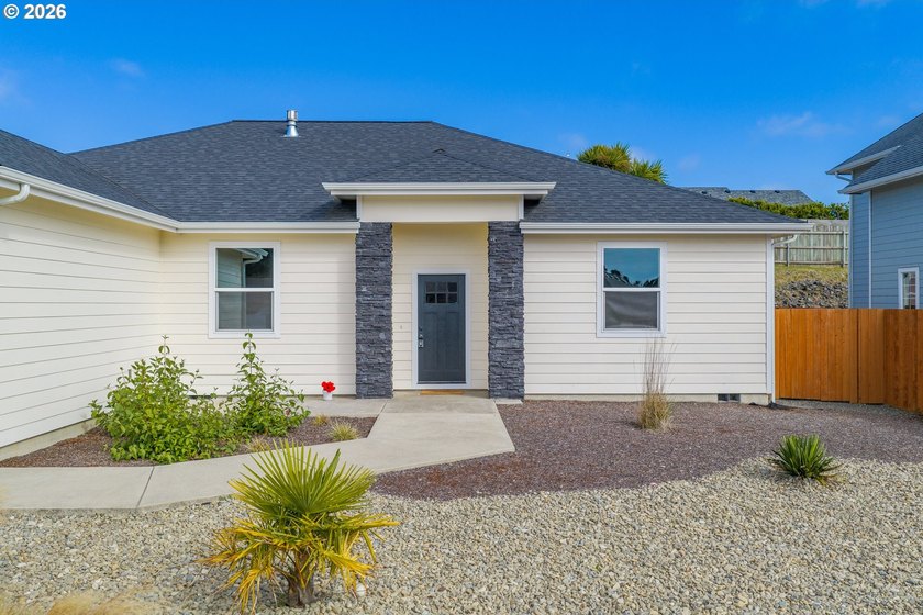 Experience modern coastal living in this custom-built 2023 home - photo 7
