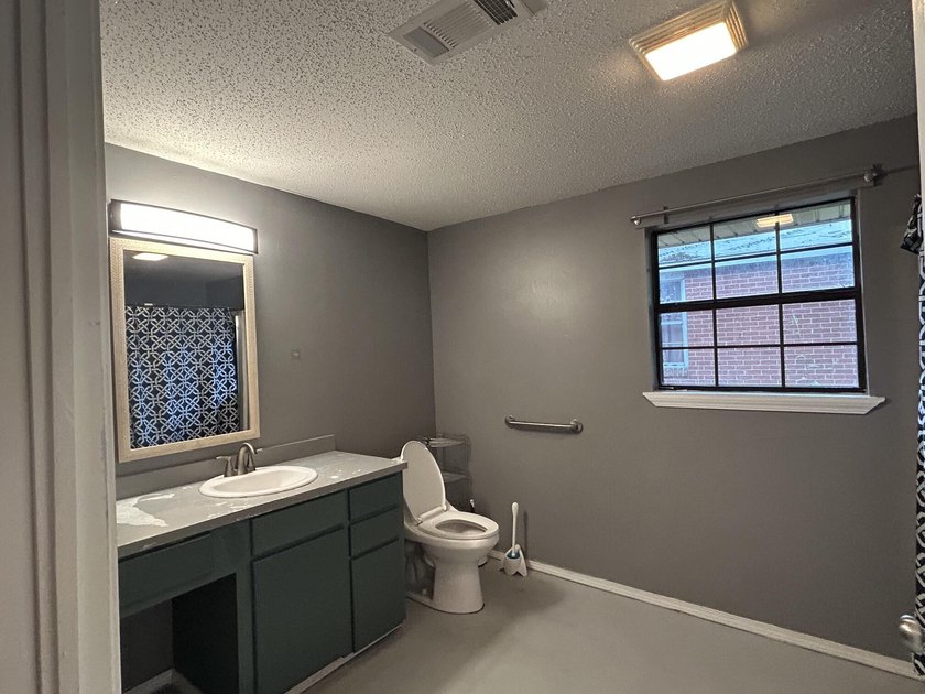 Welcome to this versatile 4-bedroom, 2-bath home offering space - photo 8